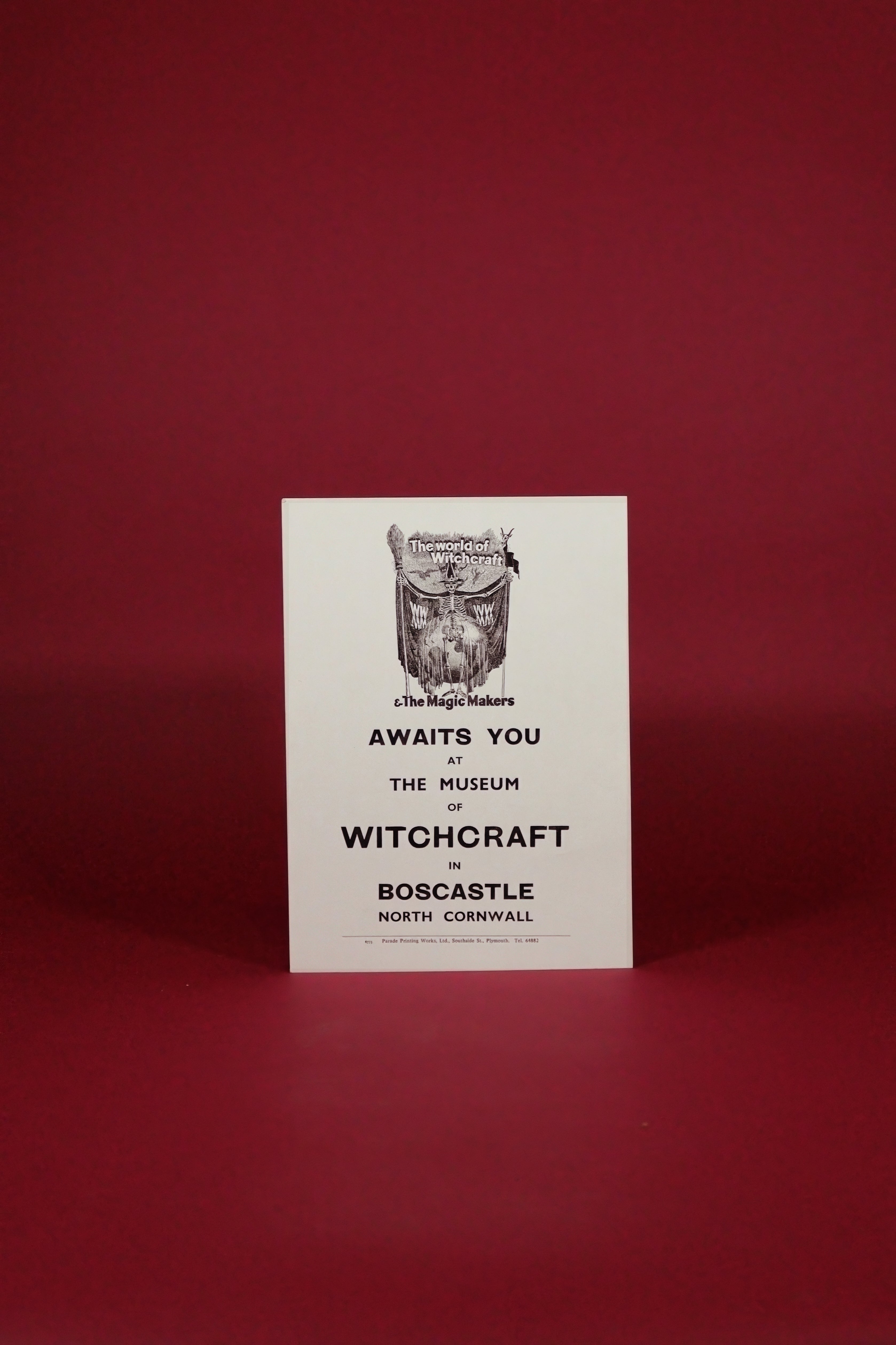Poster for the Museum of Witchcraft on a red background