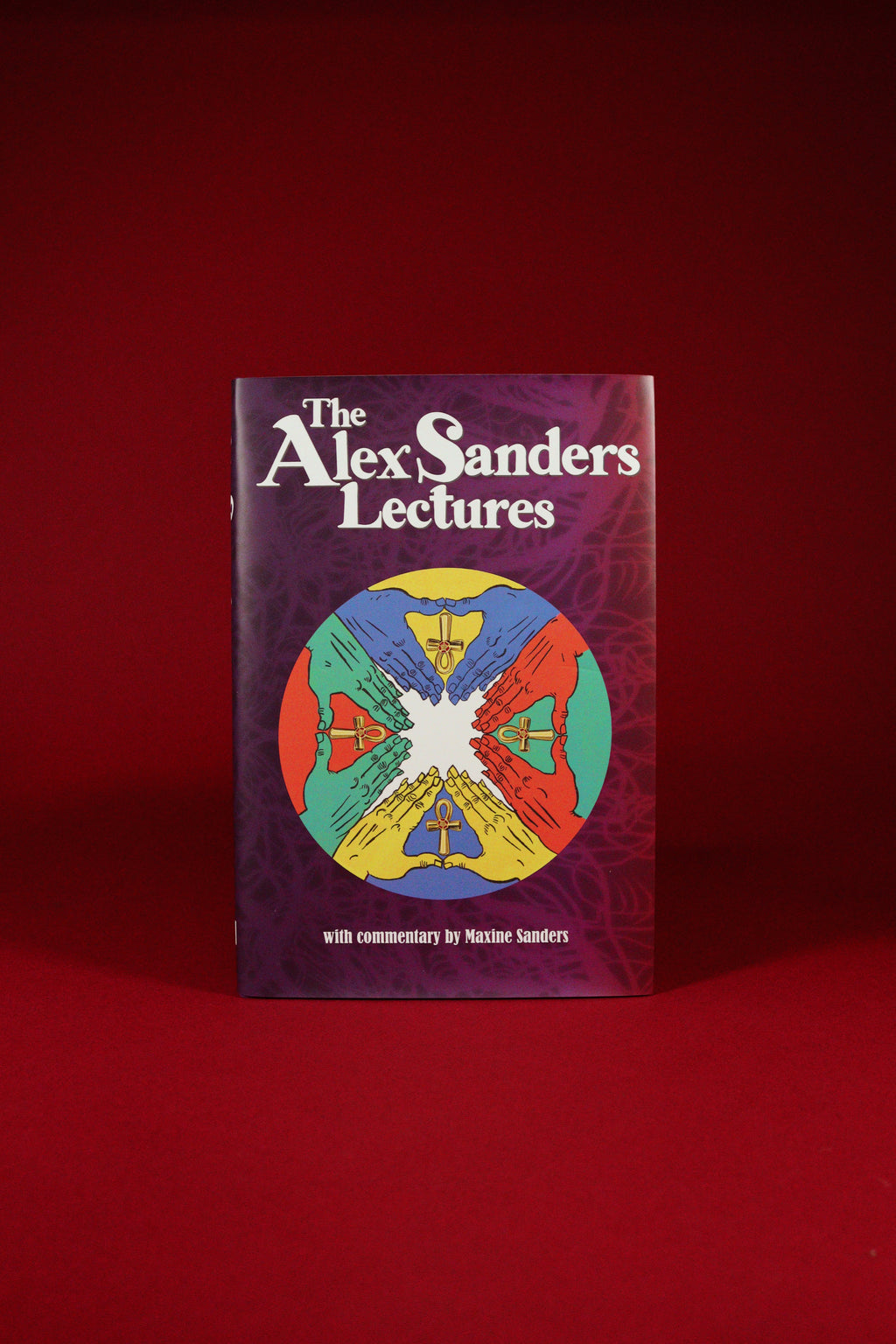Book titled 'The Alex Sanders Lectures' with a colorful design on a red background