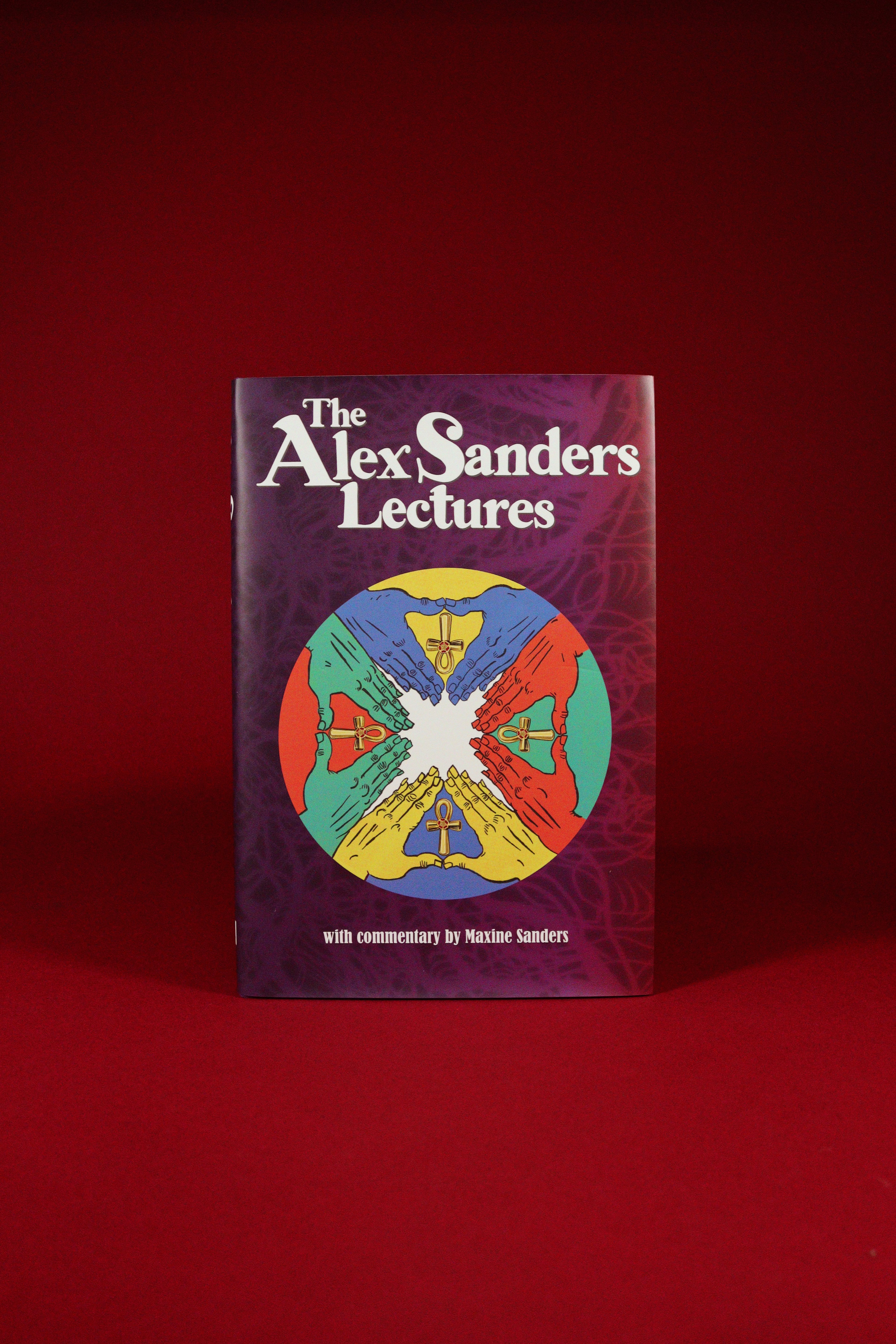 Book titled 'The Alex Sanders Lectures' with a colorful design on a red background