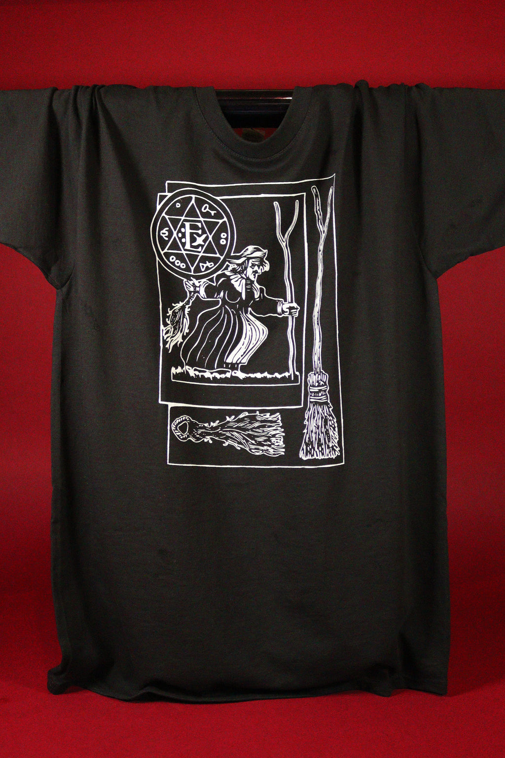 Black t-shirt with white graphic design on a red background