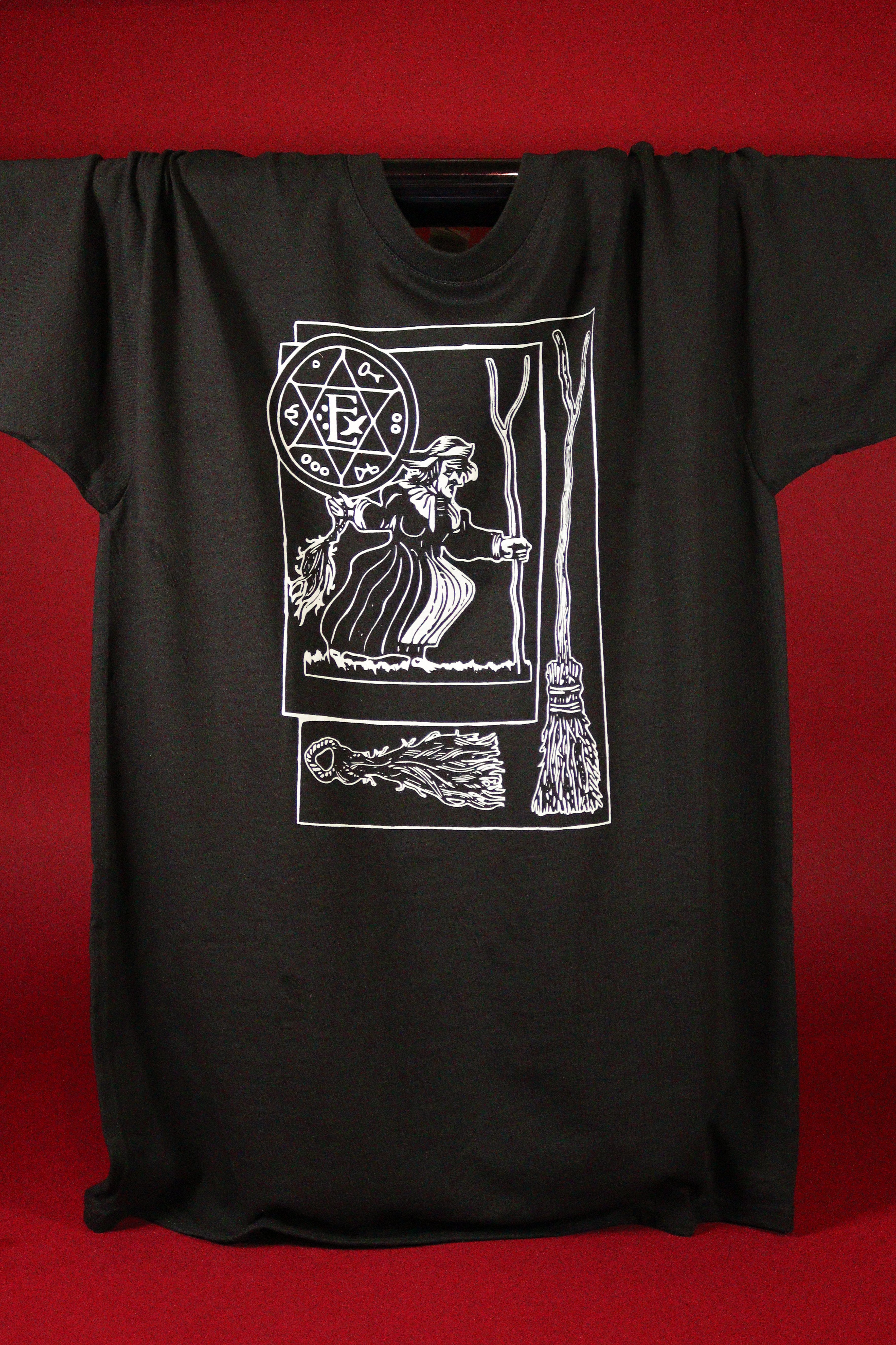 Black t-shirt with white graphic design on a red background