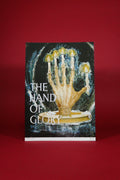 poster with the words  'The Hand of Glory' with a hand holding candles design on a red background