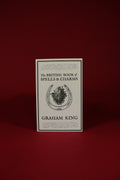 Book titled 'The British Book of Spells & Charms' by Graham King on a red background