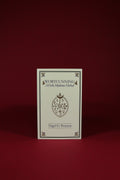 Book titled 'Wortcunning: A Folk Medicine Herbal' by Nigel G. Pearson on a red background