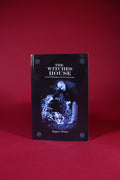 Book titled 'The Witches' House' by Rupert White on a red background