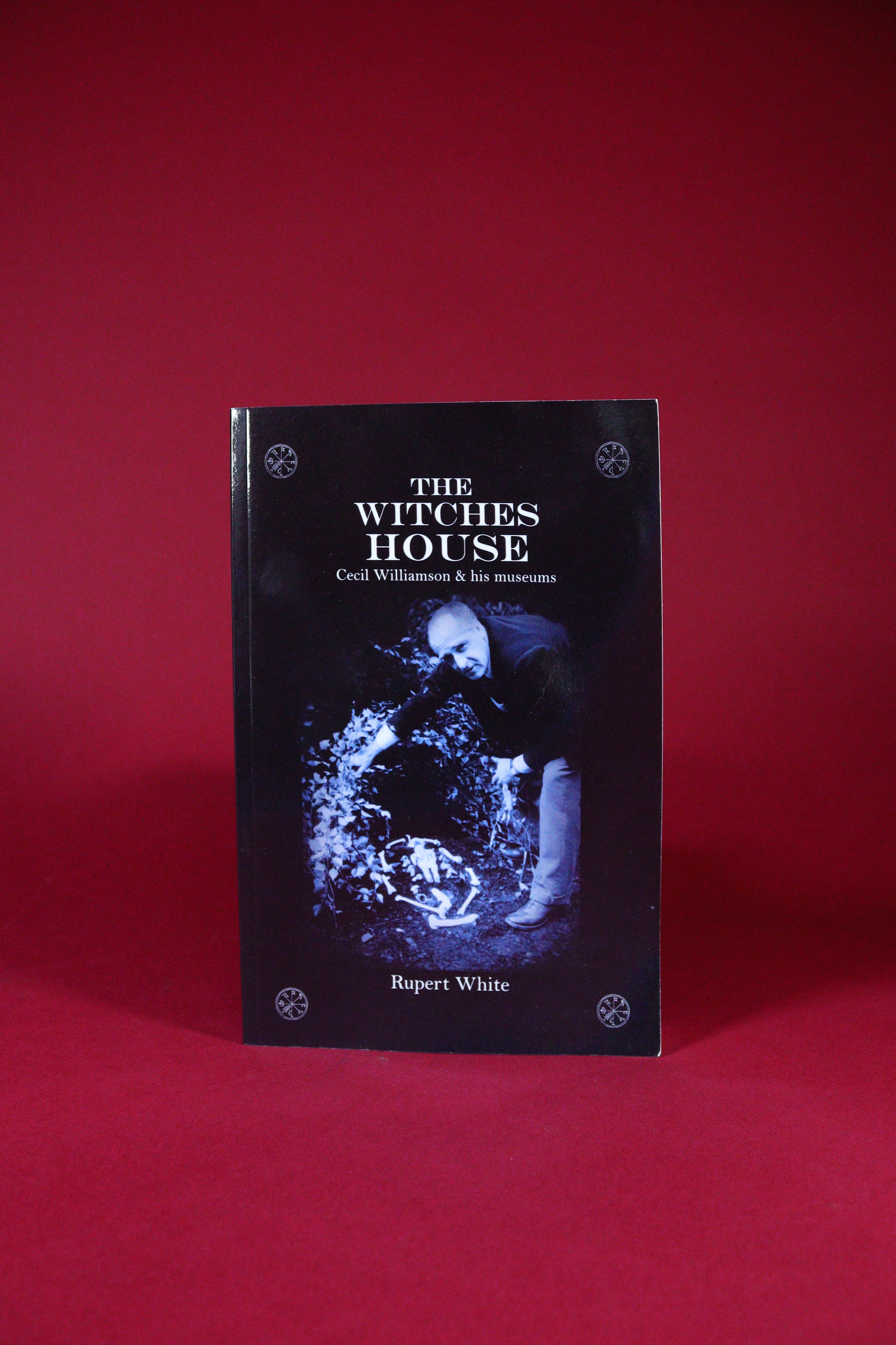 Book titled 'The Witches' House' by Rupert White on a red background