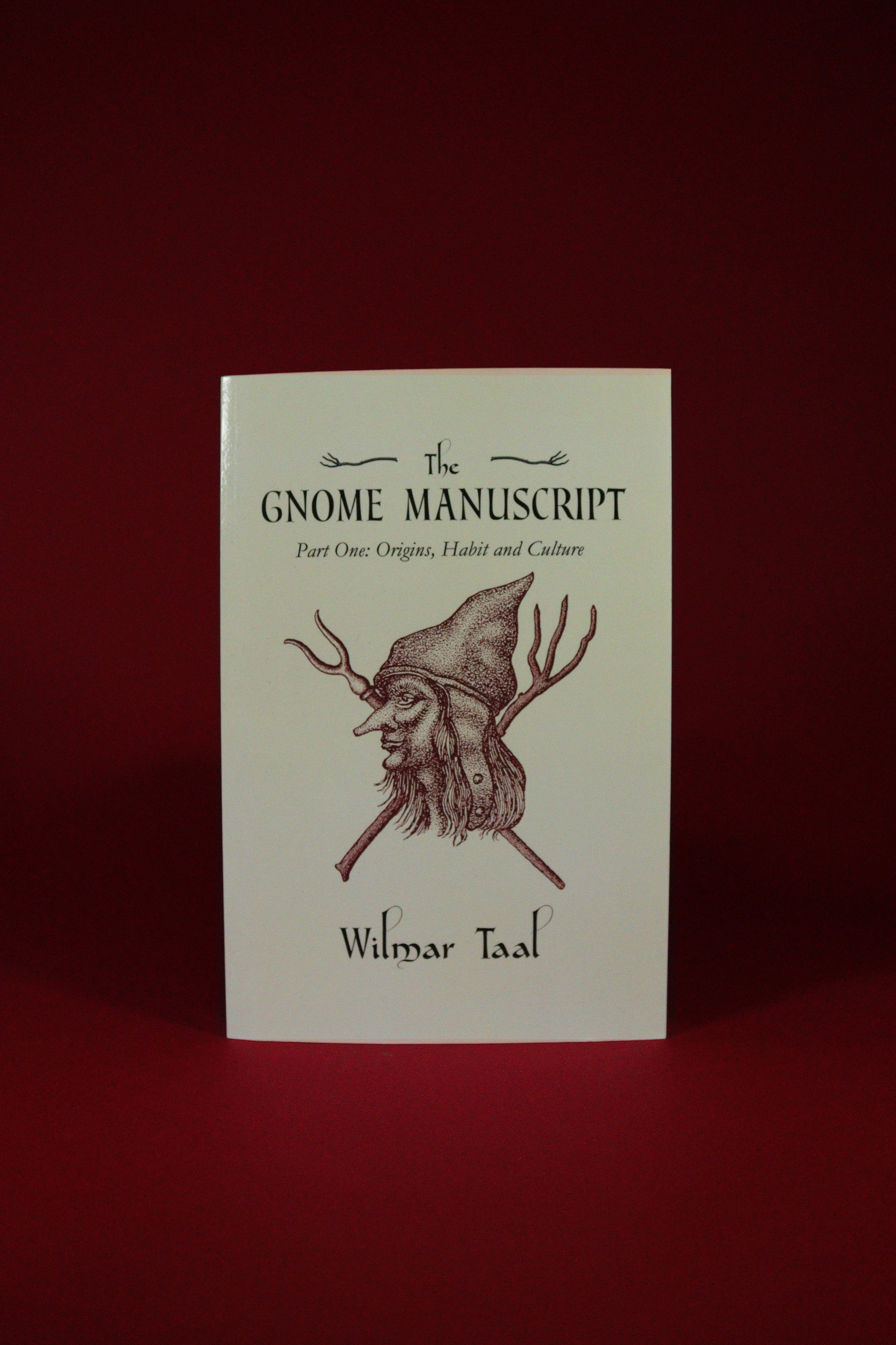 Book titled 'The Gnome Manuscript' by Wilmar Taal on a red background