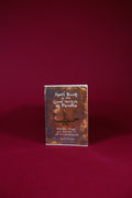 Book titled 'Spell Book of the Good Witch of Pendle' on a red background