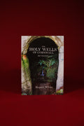 Book titled 'The Holy Wells of Cornwall' by Rupert White on a red background