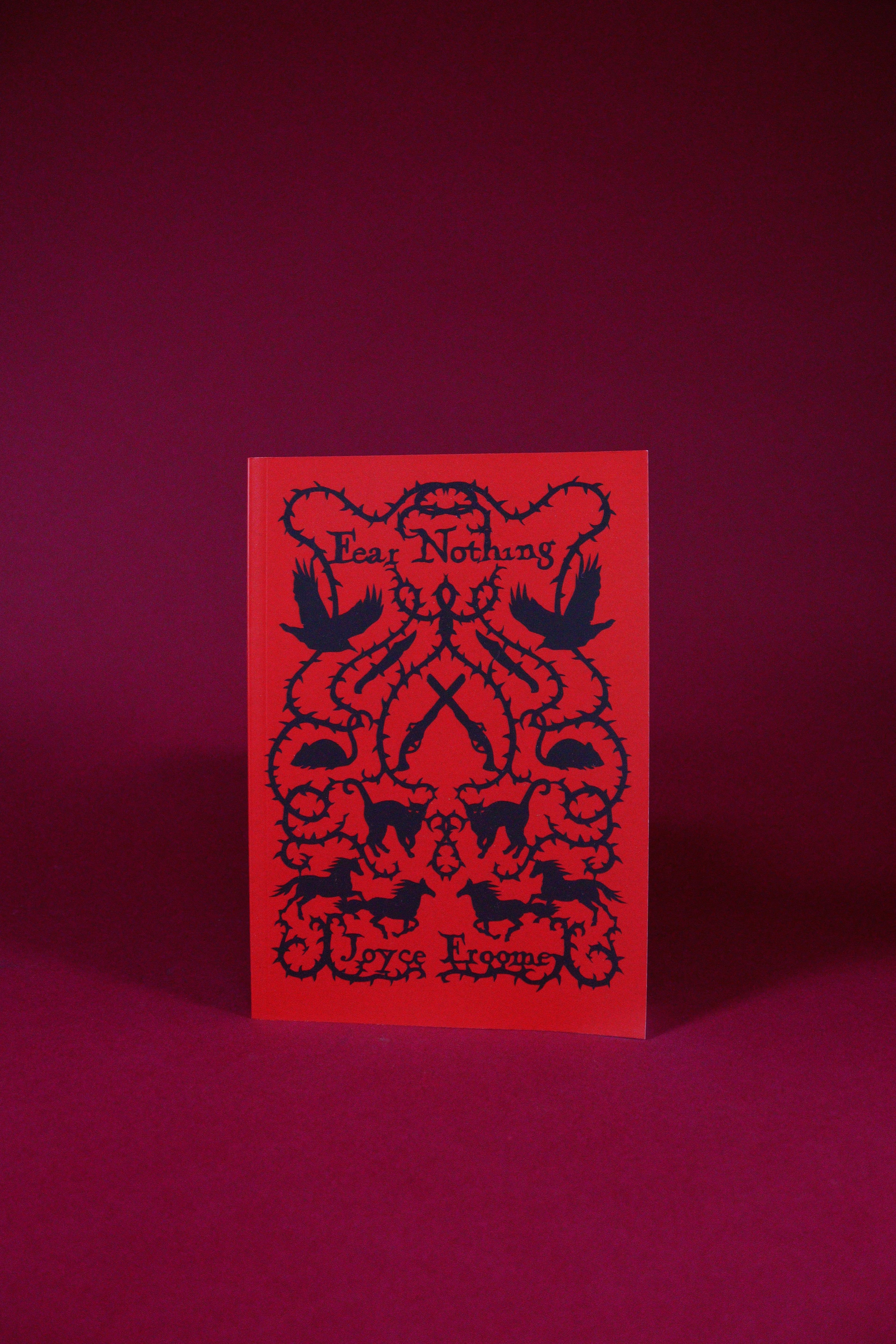 Red card with black text and design on a matching red background
