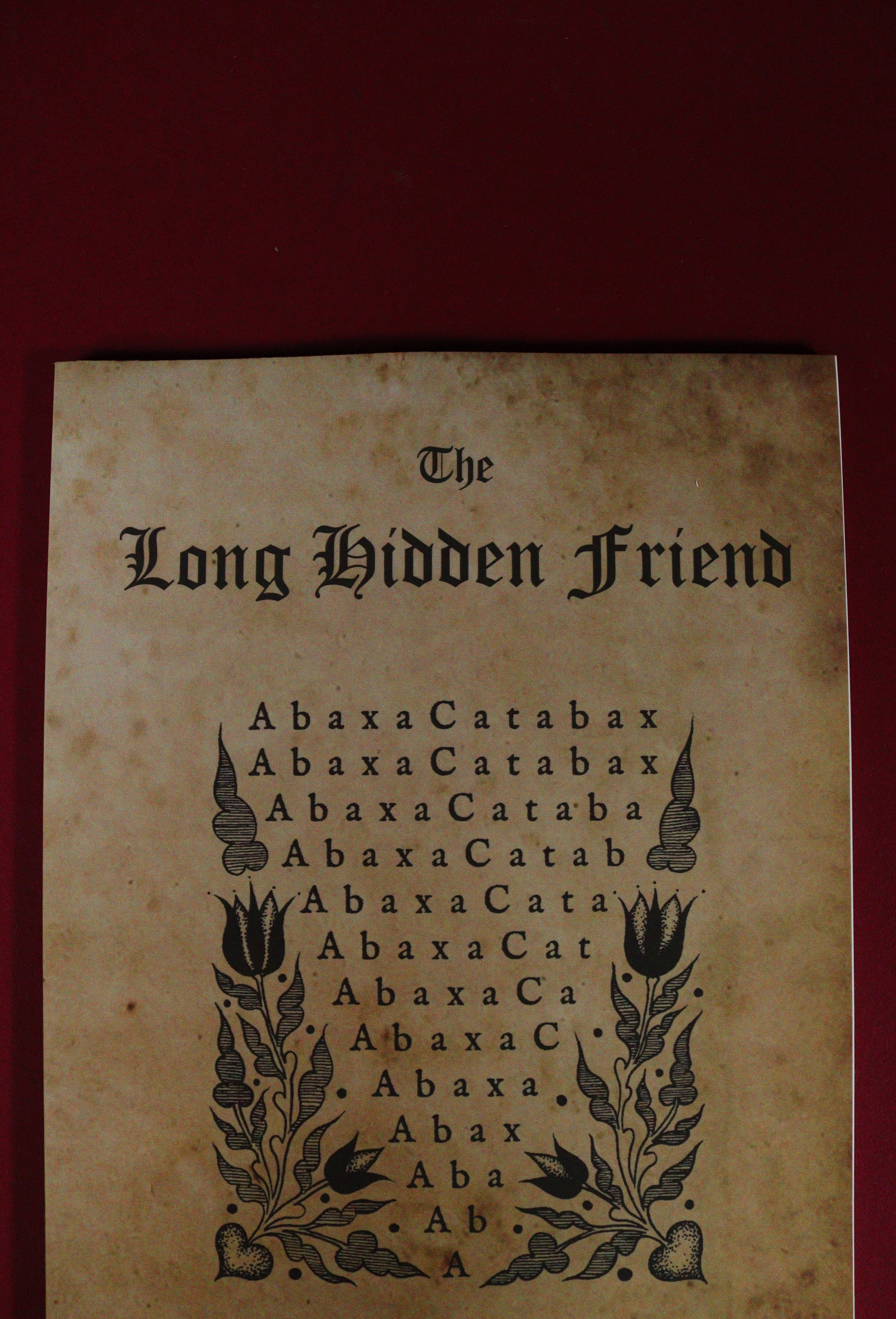 Vintage book cover with text and decorative elements on a red background