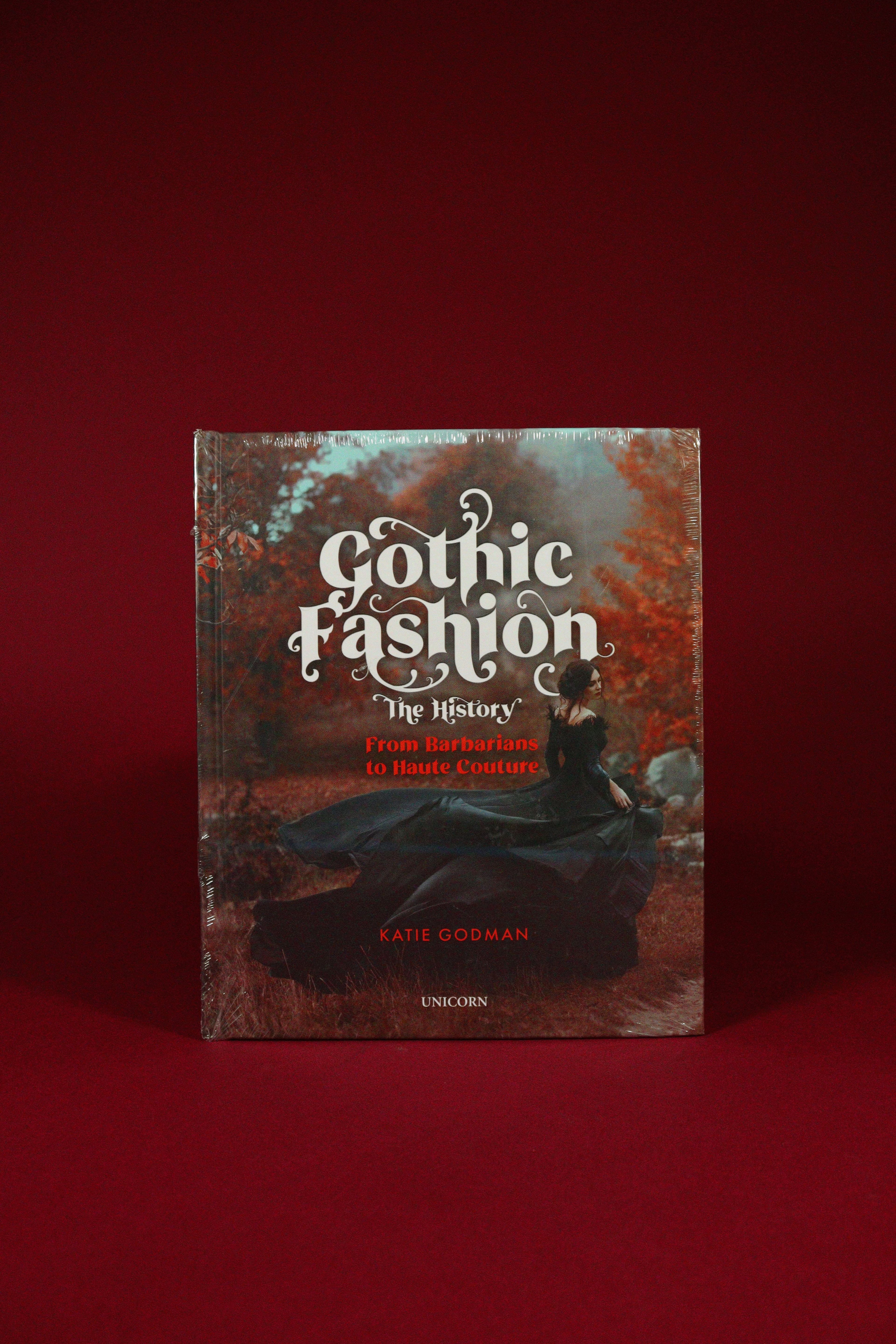Book titled 'Gothic Fashion: The History' on a red background