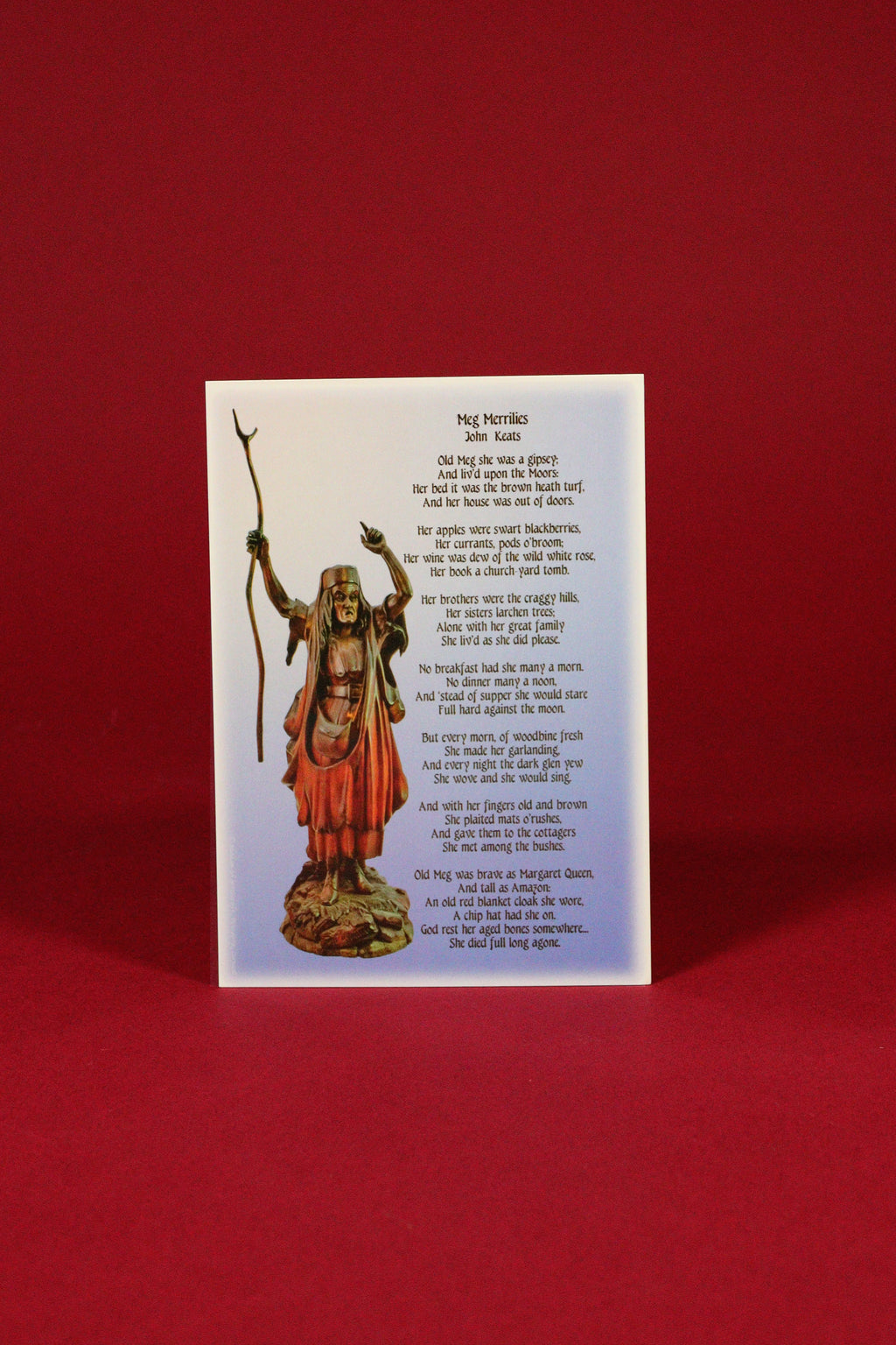 Card with a statue of a religious figure and text on a red background