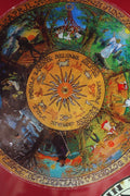 Decorative sticker with a central sun design and surrounding illustrations on a red background