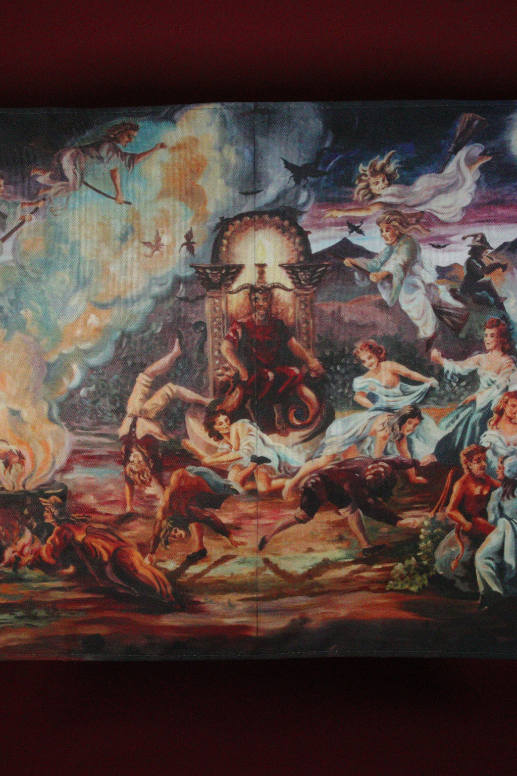 Decorative tapestry with mythological scene featuring figures and animals.