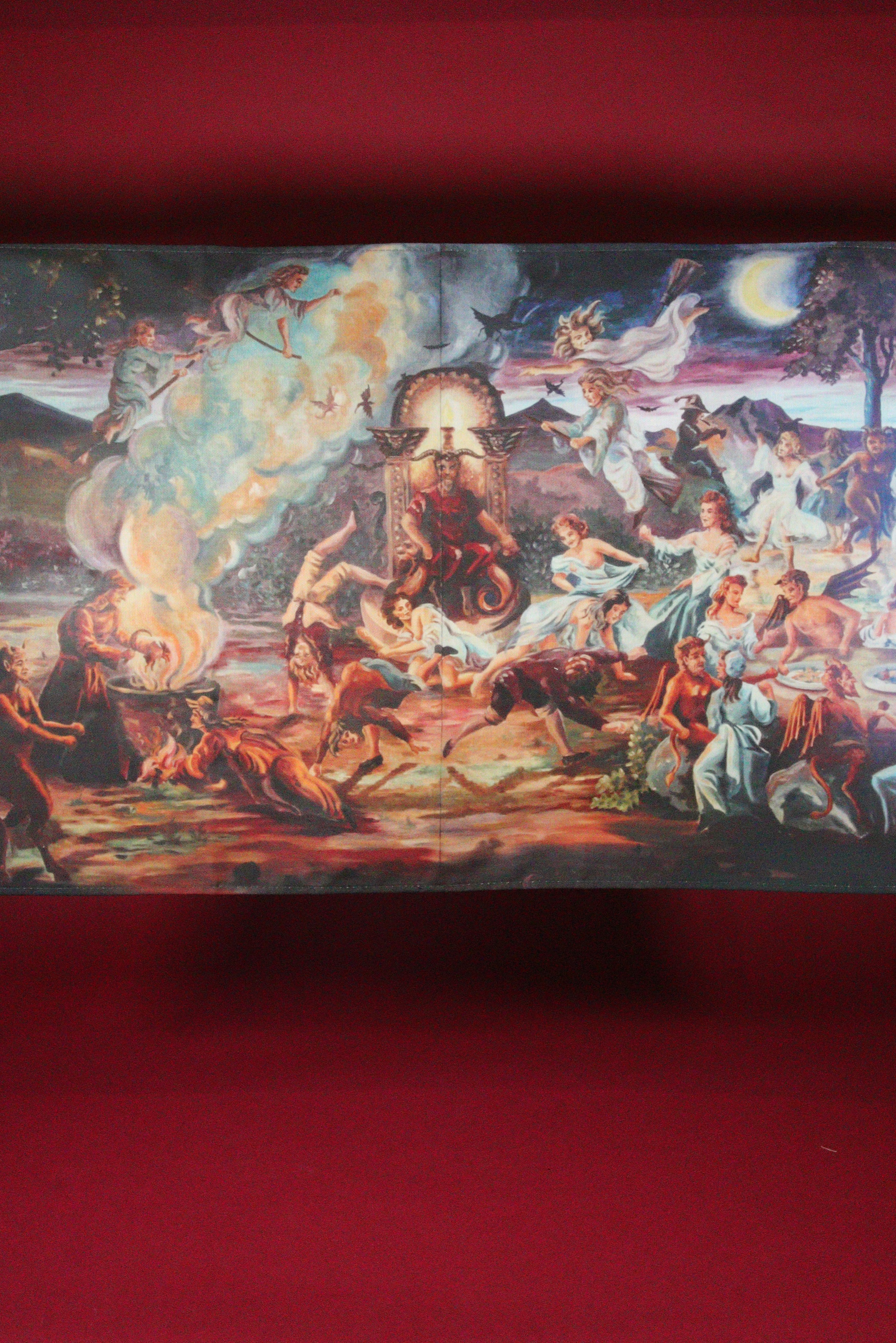 Decorative tablecloth with a colorful scene of people and animals on a red background