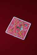Decorative patch with geometric design on a red background
