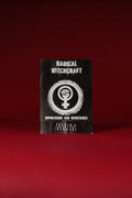 Black book titled 'Radical Witchcraft' with a white symbol on a red background