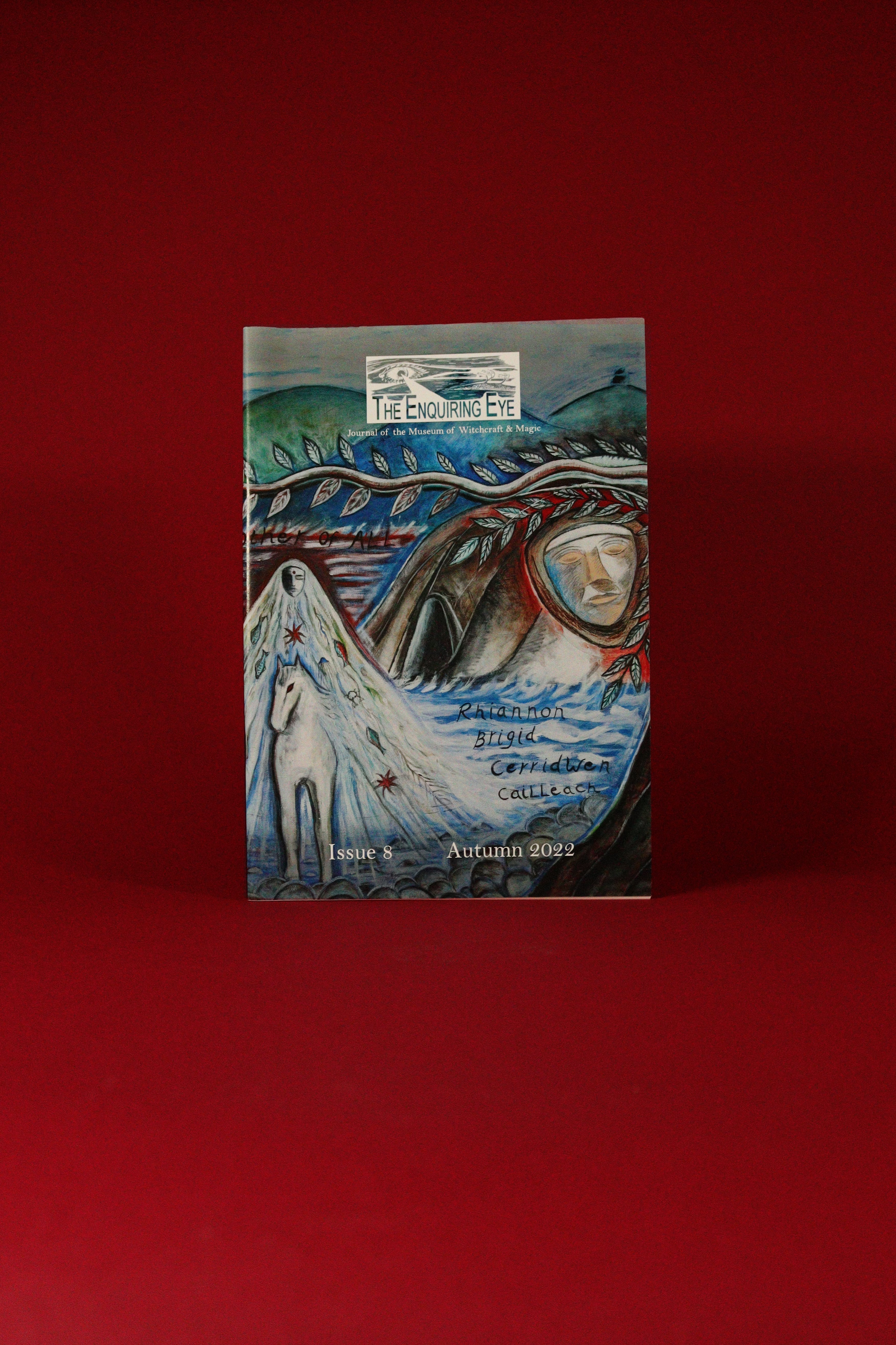 Booklet with artistic cover featuring a landscape and text on a red background