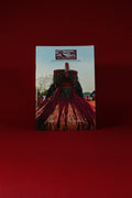 Book or magazine with a red cover featuring text and images on a red background