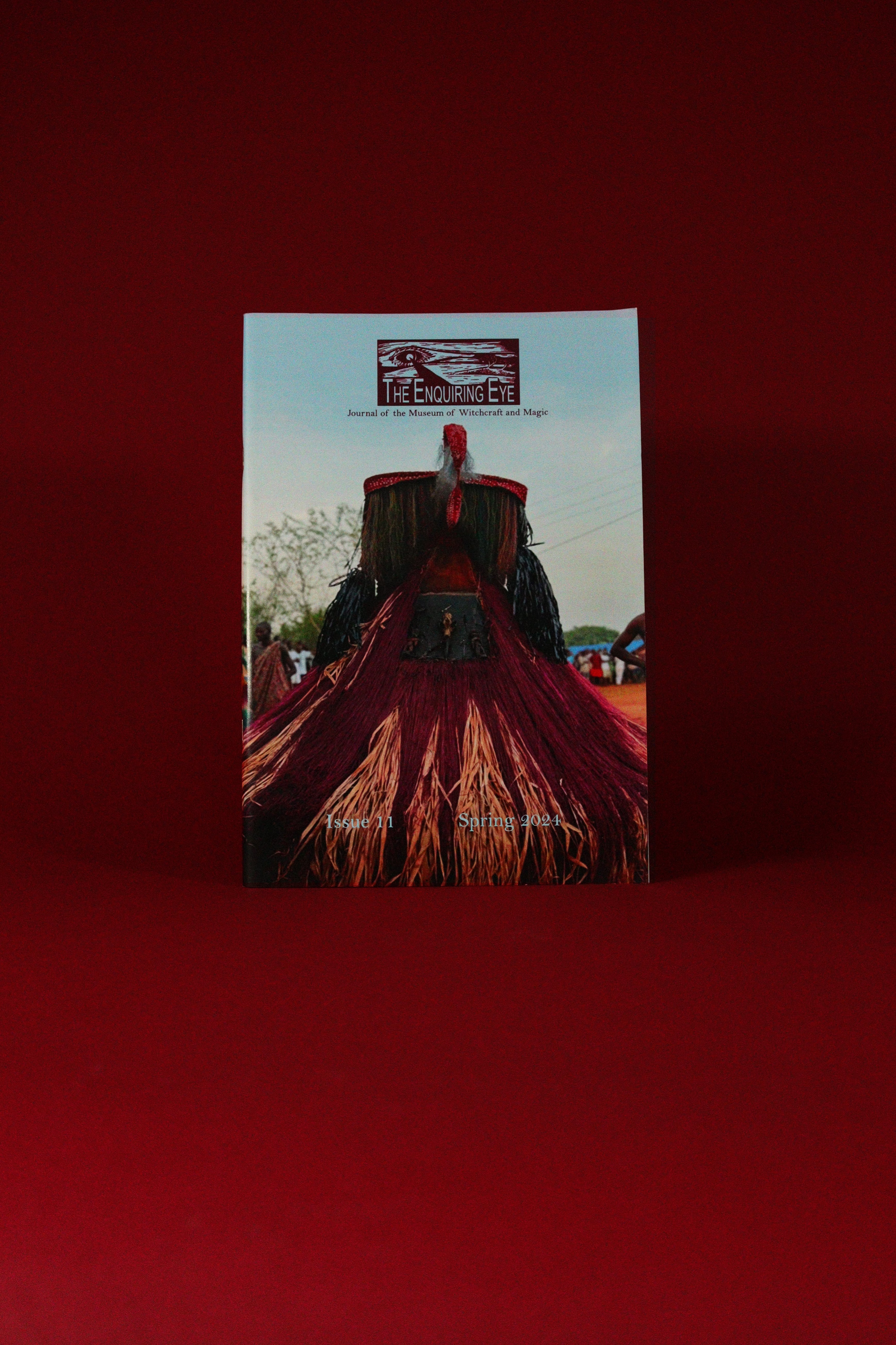 Book or magazine with a red cover featuring text and images on a red background