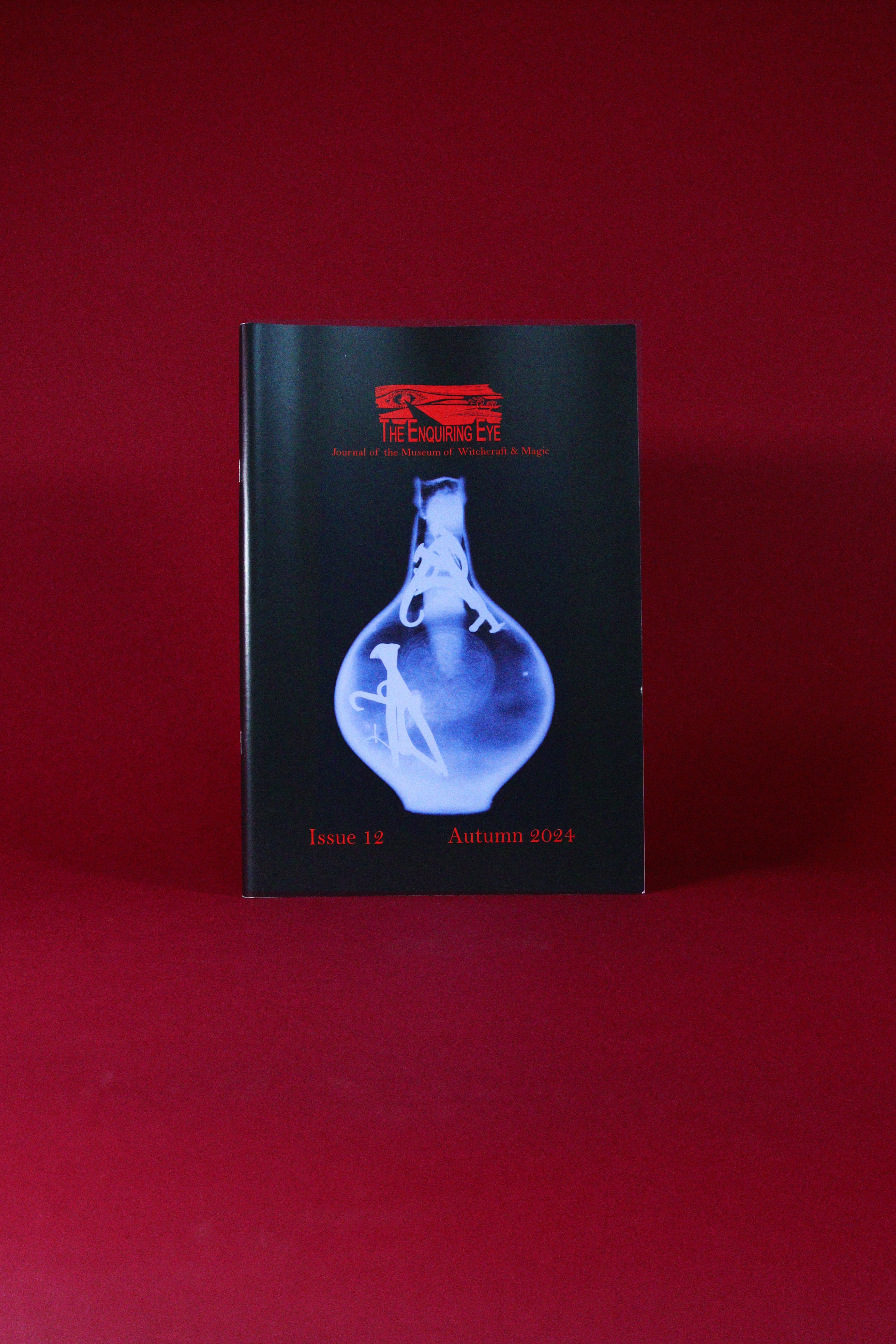 Book or magazine with a blue cover design on a red background