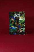Magazine or book with a colorful cover featuring a cross and flowers on a red background